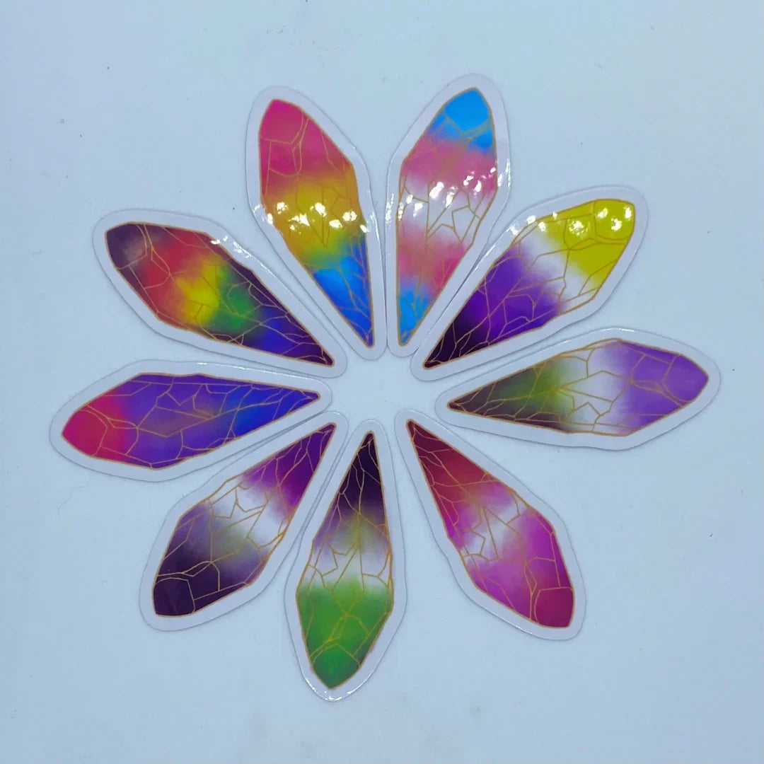 Set of colorful, gradient-patterned nail stickers with gold geometric lines arranged in a circle