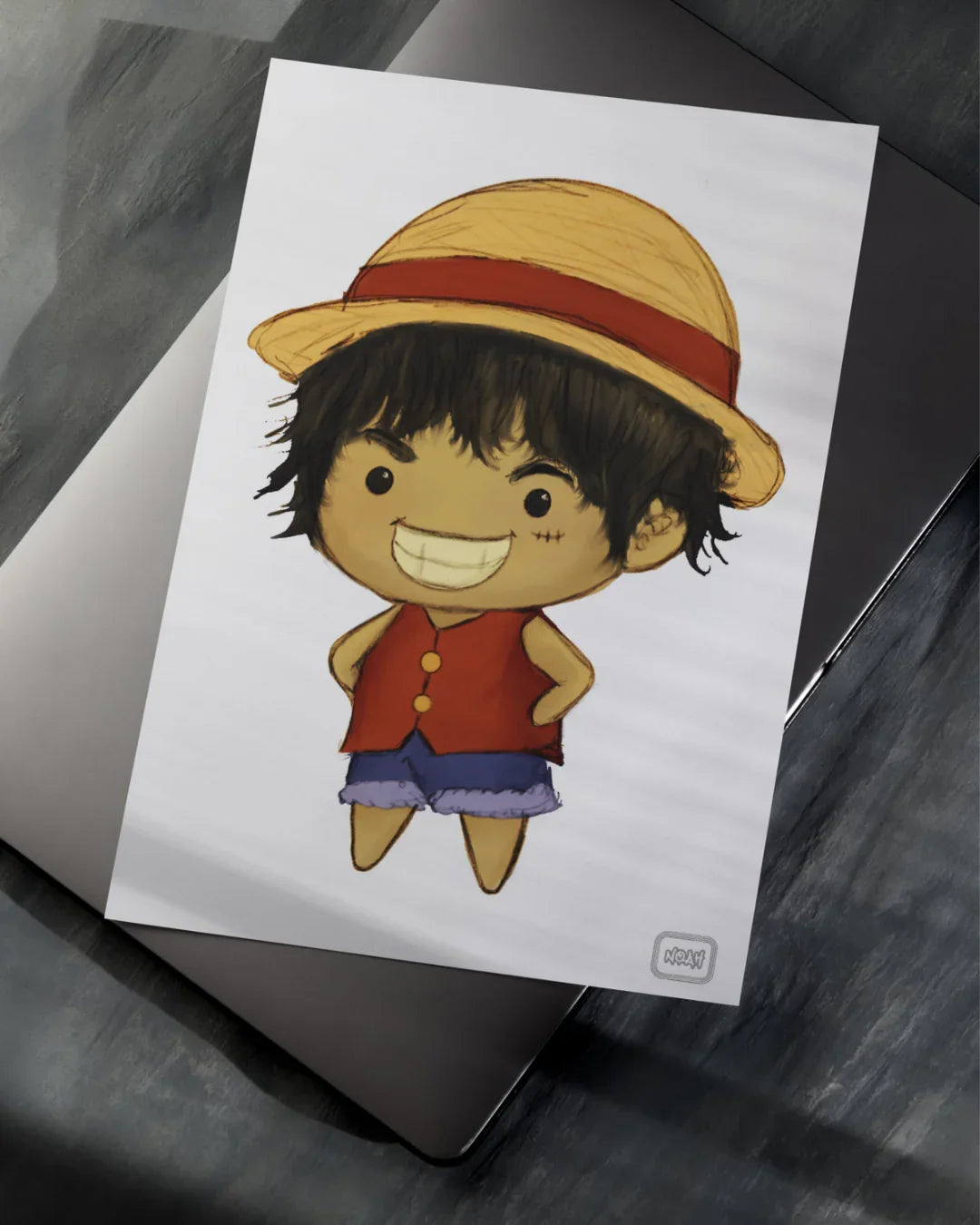 Chibi cartoon character with straw hat, red vest, purple shorts, and big grin on white paper